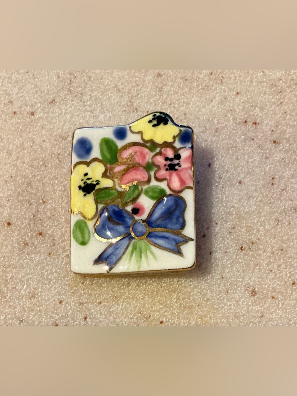 Hand-Painted Floral Porcelain Pin with Blue Bow
